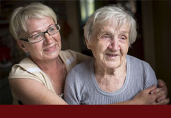 Older daughter and grandmother together and hugging - click for "Massachusetts Health Care Proxy"